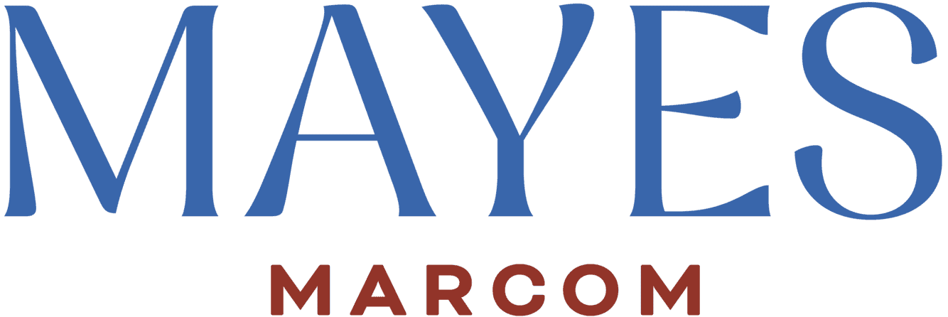 Logo of Mayes Marcom featuring the word "MAYES" in large blue capital letters and "MARCOM" in smaller red capital letters below. The background is transparent.