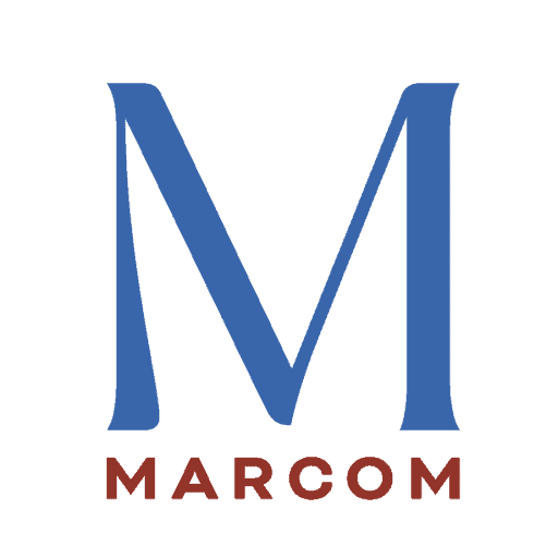 A logo featuring a large blue letter "M" on a black background. Beneath it, the word "MARCOM" is written in uppercase letters in a dark brown color. The design is simple and modern, with a focus on bold typography.